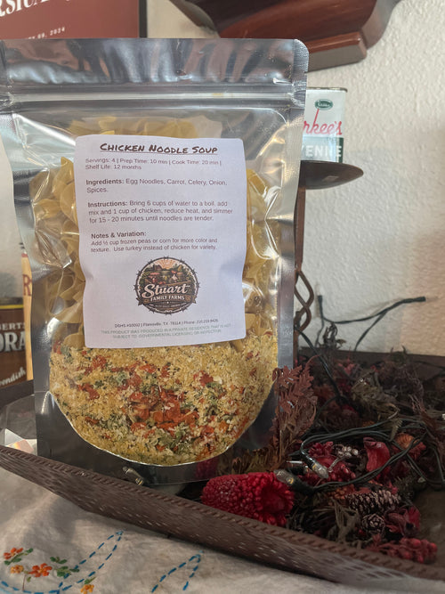 Package of dried soup mix with a label on a textured surface